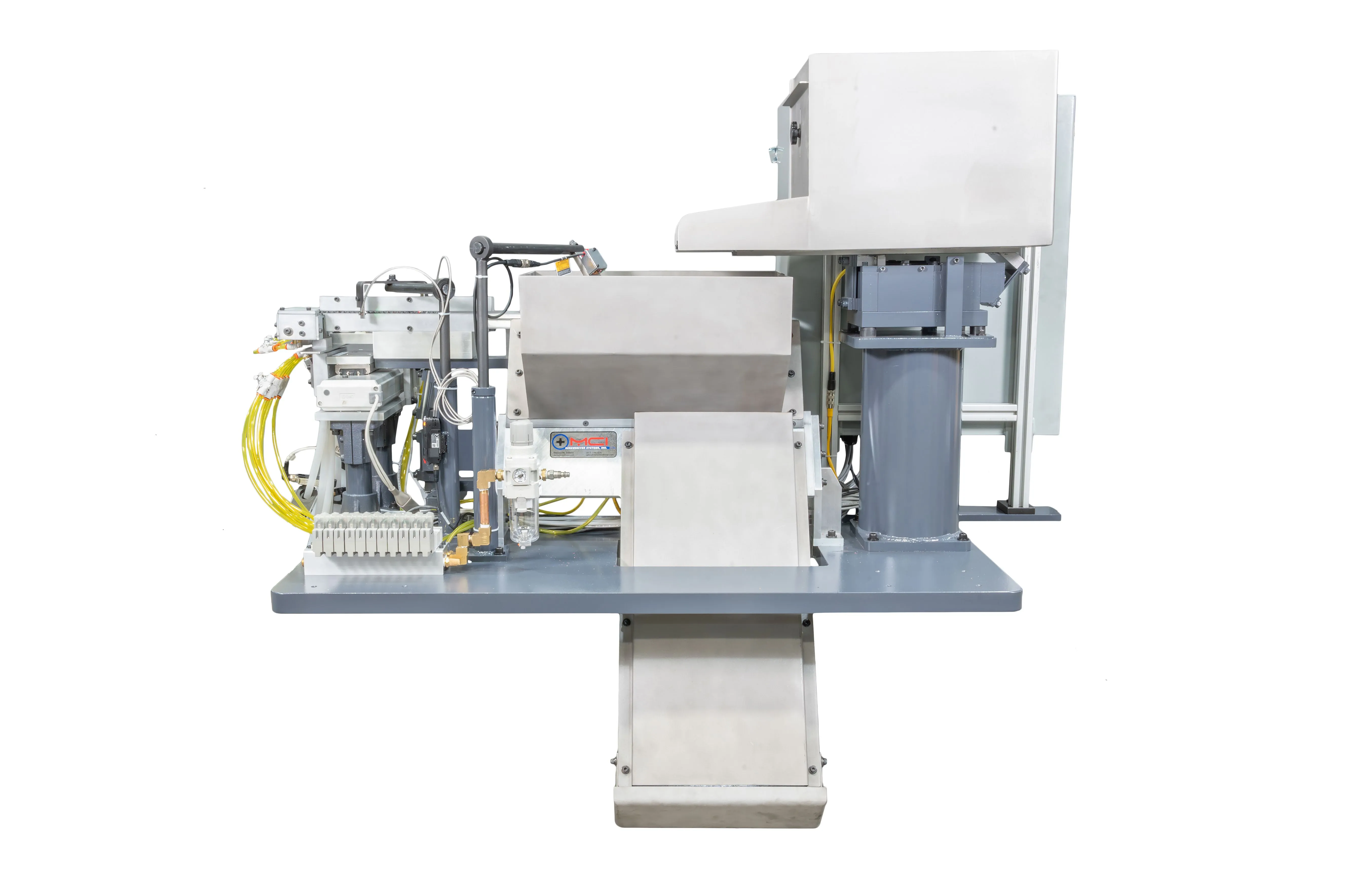 Industrial automated machine with various components including cables, control boxes and mechanical parts on a steel platform, isolated on a white background.