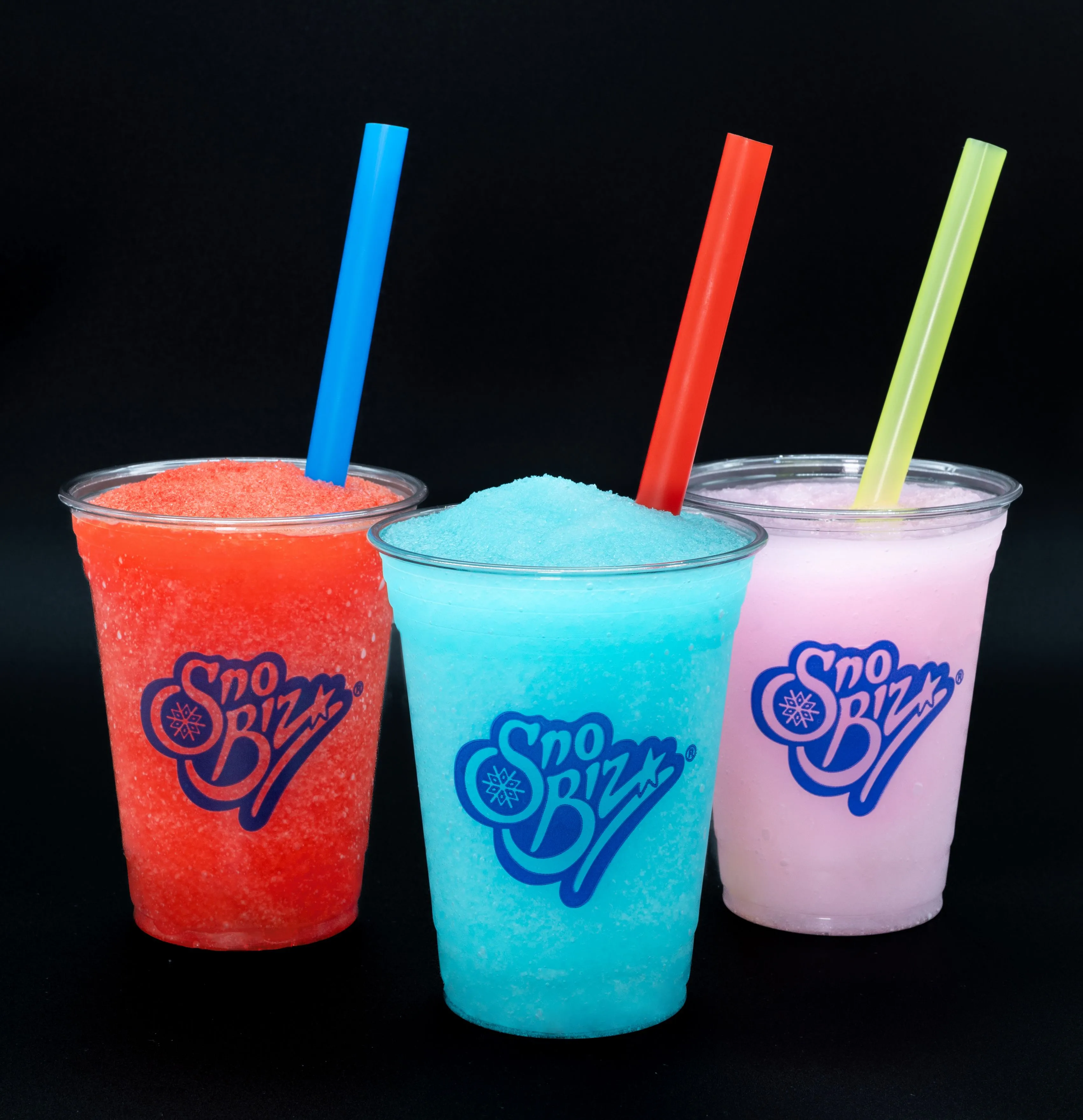 Three colorful frozen drinks with straws, branded as Sno Biz, on a black background.