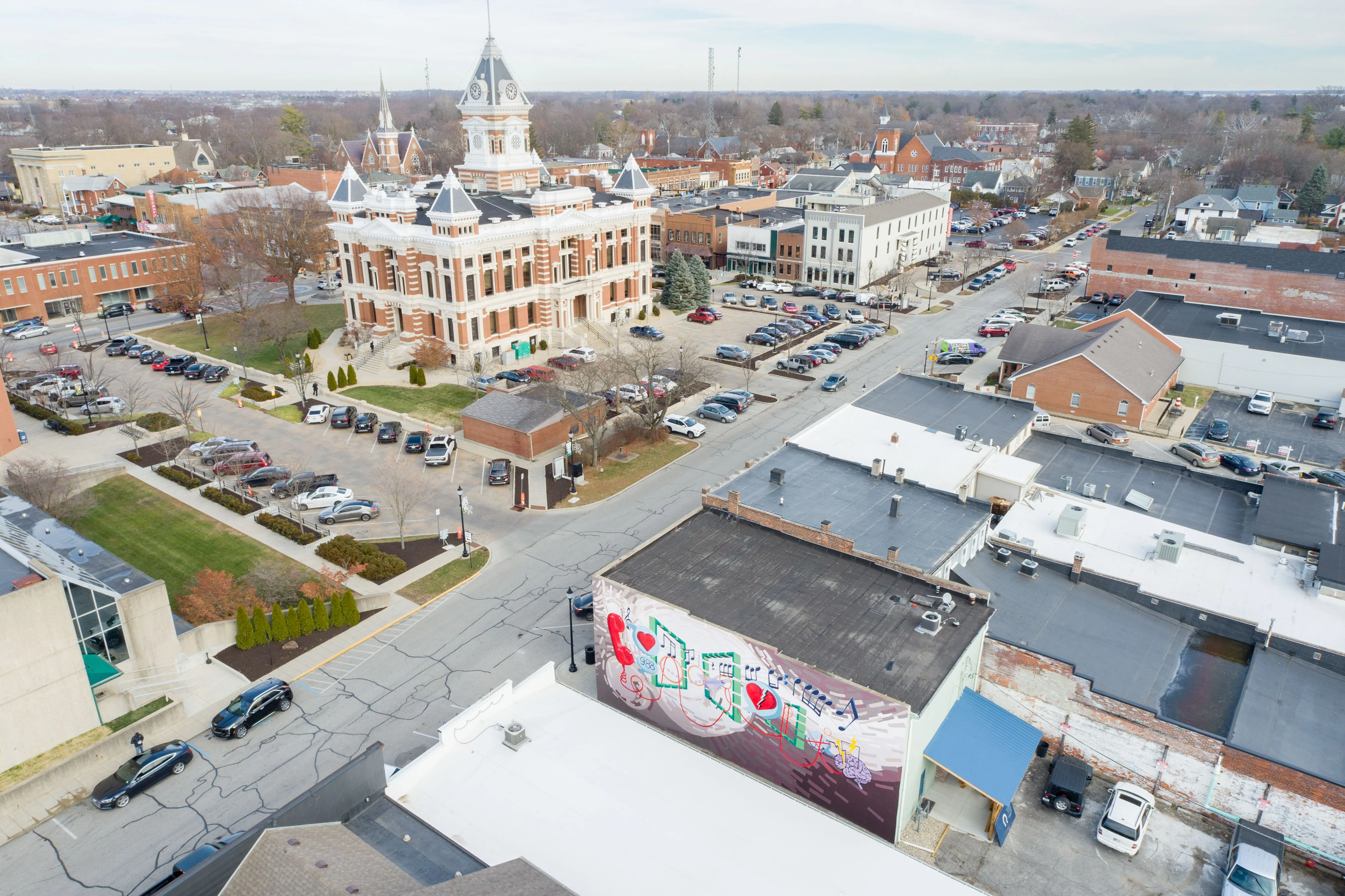 Aerial view of a small town with historic buildings and a courthouse with a dome.