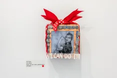 Decorative wall piece featuring the iconic "We Can Do It!" poster with a red bow, encased in a frame adorned with small red-and-white polka dot bows.