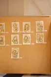 Nine ornate patterns displayed in a 3x3 grid on a beige wall.
