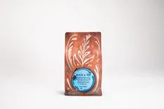 Bag of Black & Tan Mixed Roast coffee on a plain white background with decorative swirl patterns and brand logo visible.