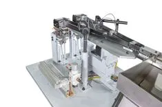 Industrial automated linear conveyor system machine for processing and packaging on a white background.
