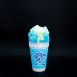 A blue raspberry Sno-Biz shaved ice in a cup with sweet cream topping overflowing against a black background.