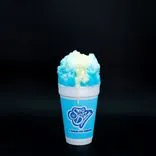 Blue raspberry shaved ice in a Sno Biz cup with sweetened condensed milk topping, on a black background.