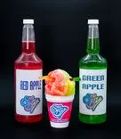 Two bottles labeled 'Red Apple' and 'Green Apple' flanking a colorful shaved ice in a Sno Biz cup on a black background.